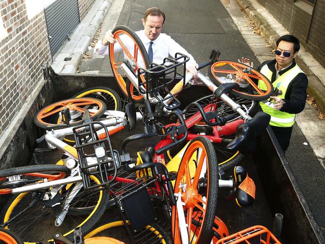 EXCLUSIVE INNER WEST COURIER NOT TO BE USED BY OTHER MEDIA UNTIL 30/5/2018 L to R: Inner West mayor Darcy Byrne and Council Ranger Bang Le  load   share bikes onto the truck in  Australia Street , Camperdown.  Inner West Council Rangers are impounding damaged share bikes across the Inner West. Picture: John Appleyard