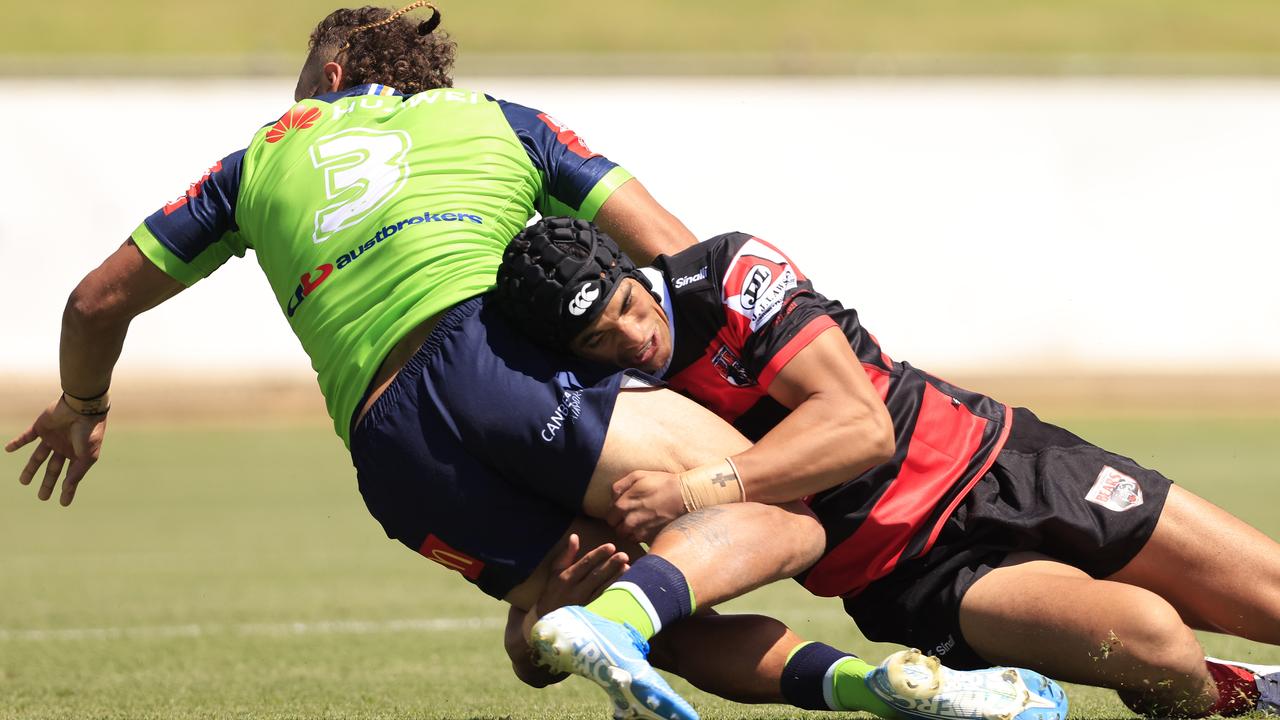 Joseph Suaalii tackles Raiders centre Seb Kris. Picture: Mark Evans/Getty Images