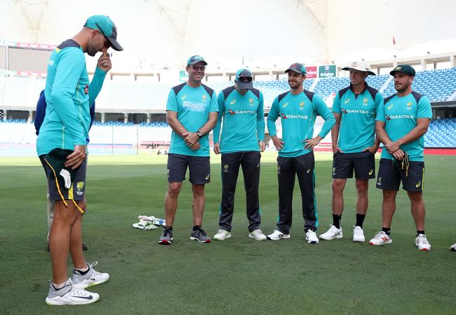 Nathan Lyon shows his emotions as he presents Travis Head with his baggy green.