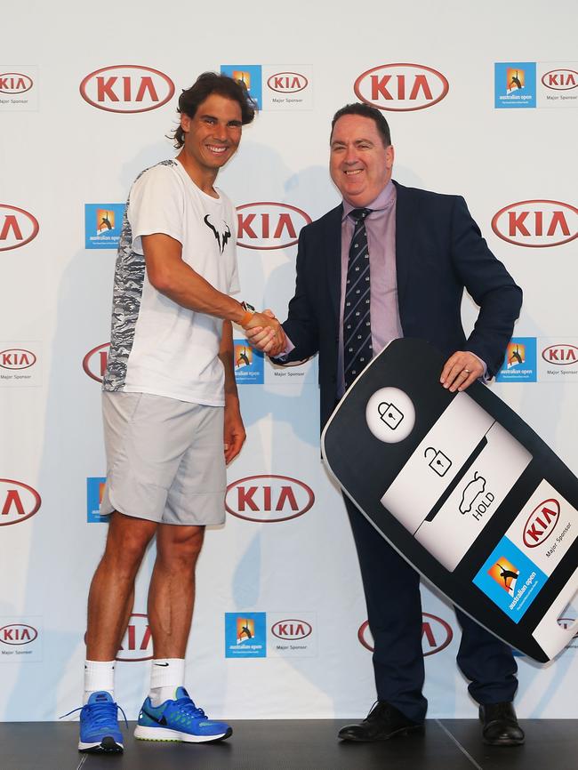 Rafael Nadal of Spain and Kia's COO Damien Meredith pose during a Kia Key handover ceremony at Garden Square in Melbourne Park on January 13, 2016 Picture: Graham Denholm/Getty