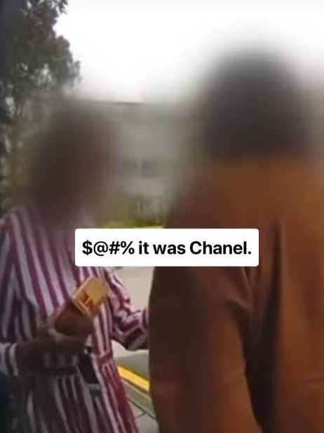 The woman used the red Chanel lipstick to vandalise the poster. Picture: Facebook/Mosman Collective