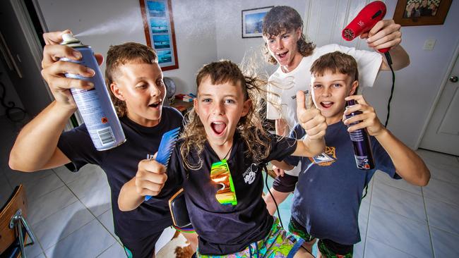 **** WEEKEND PAPERS ***** Elijah Gunn, 8, celebrates winning the best mullet with his siblings Kayden, 13, Macalister,15 and Braithan, 10.Picture: Nigel Hallett