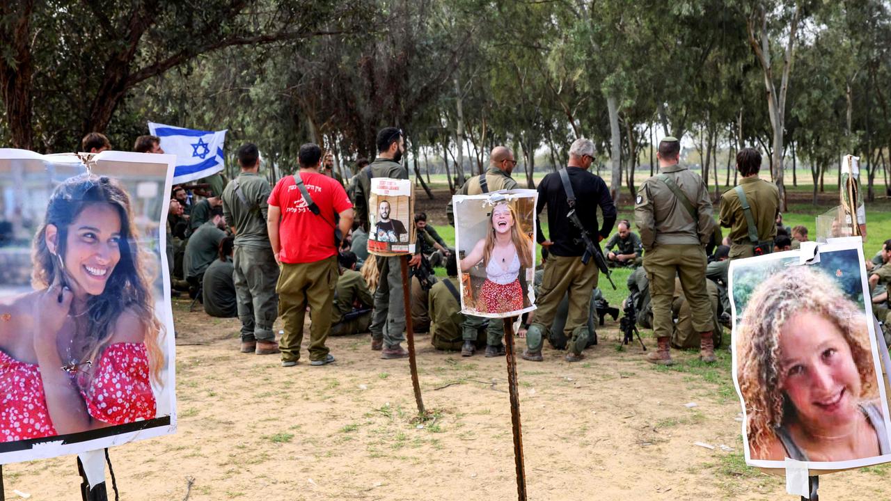 Israeli soldiers gather at the abandoned site of the Supernova music festival. Picture: Jack Guez/AFP