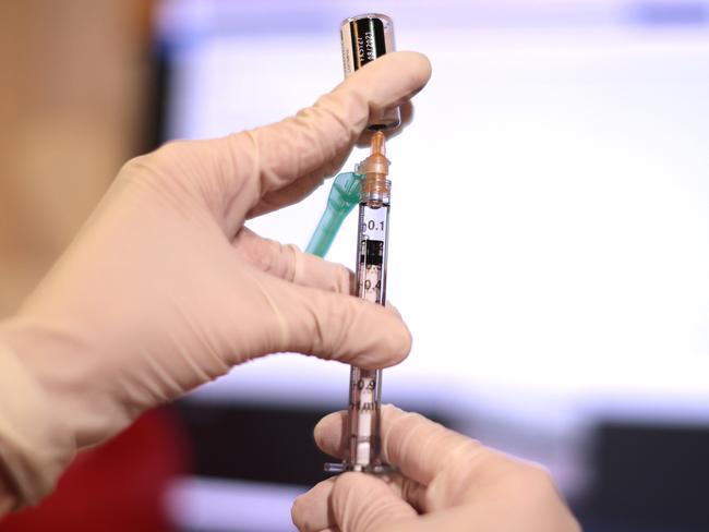 ANNANDALE, VIRGINIA - NOVEMBER 04: A pharmacist prepares a child-sized dose of the Pfizer BioNTech COVID-19 vaccine at the Fairfax County Government Center on November 04, 2021 in Annandale, Virginia. The federal government approved the coronavirus vaccine for children between the ages of 5 and 11 this week.   Chip Somodevilla/Getty Images/AFP == FOR NEWSPAPERS, INTERNET, TELCOS & TELEVISION USE ONLY ==