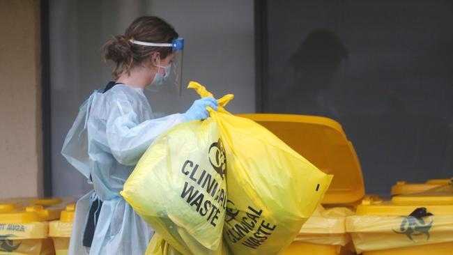 St Basil's Home for the Aged has been hit hard by COVID-19 cases. Clinical waste bags bins get filled up by staff at the site. Picture: Sarah Matray