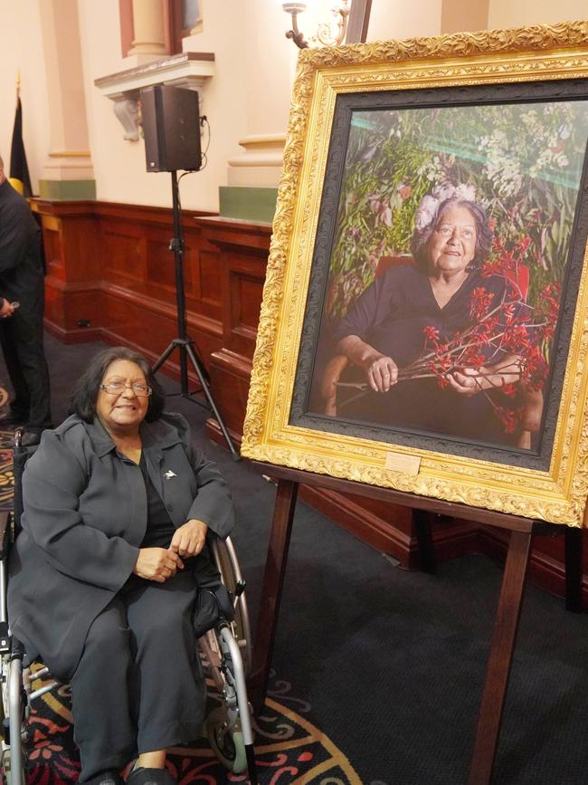 Aunty Shirley Peisley AM with her portrait by artist Dr Ali Gumillya Baker that is now hanging in Adelaide Town Hall. Picture: Supplied