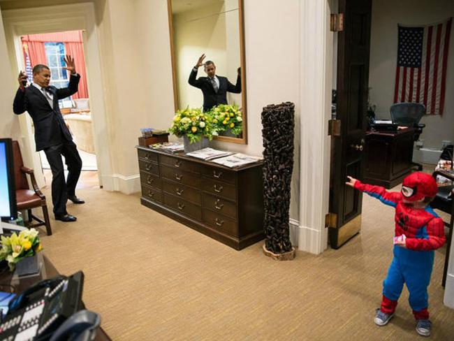 President Barack Obama pretends to be caught in Spider-Man’s web as he greets the son of a White House staffer in the Outer Oval Office on October 26, 2012. Picture: Pete Souza/The White House