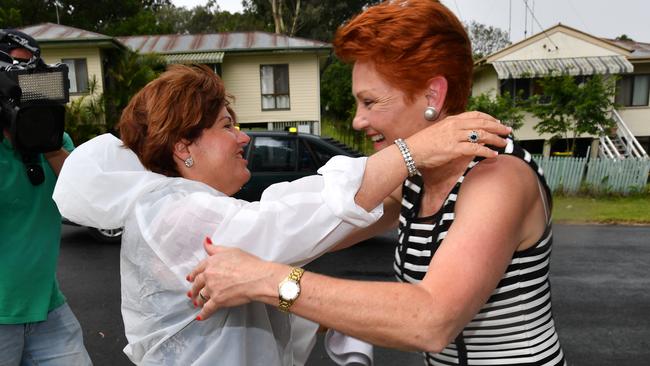 One Nation leader Senator Pauline Hanson and ALP member for Bundamba Jo-Ann Miller greet each other in Bundamba. Picture: AAP Image / Darren England