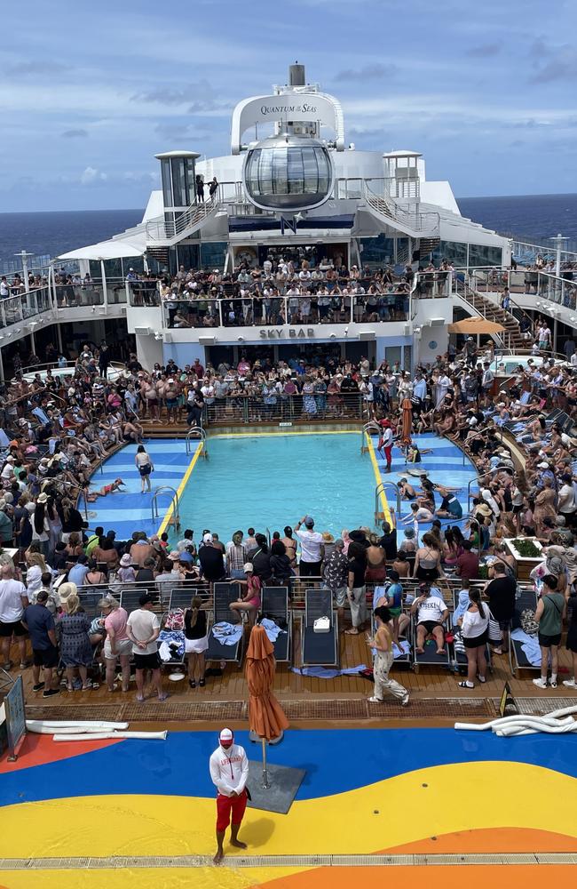 Crowds pack out the top deck to vote for the best cruise belly-flop competition. Picture: JENI FAULKNER