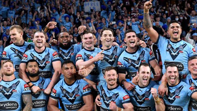 Nathan Cleary (back row, second from right) celebrates with his Blues teammates after they clinched the Origin series win over Queensland. Picture: Bradley Kanaris/Getty Images