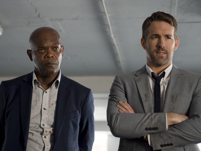 This image released by Lionsgate shows Samuel L. Jackson, left, and Ryan Reynolds in 
