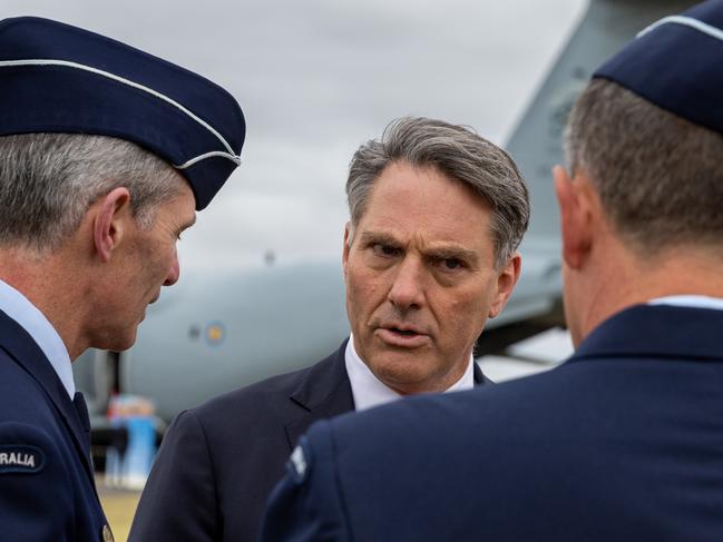 AVALON, AUSTRALIA - MARCH 03: Australian Deputy Prime Minister, Richard Marles (centre) speaks with RAAF Chief of Air Force Robert Chipman (left)  on March 03, 2023 in Avalon, Australia. The 2023 Australian International Airshow & Aerospace and Defence Exposition (AVALON 2023) will open on Tuesday. Organizers say that there is a 14 percent increase over the 2019 event in exhibitors, and nearly 50 percent more industry, government, defence and scientific delegations. The show comes at a time of increasing military tension in both the Asia-Pacific and North Asia. (Photo by Asanka Ratnayake/Getty Images)