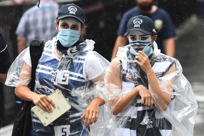 BRISBANE, AUSTRALIA - OCTOBER 24: Fans arrive at the Gabba during the 2020 AFL Grand Final match between the Richmond Tigers and the Geelong Cats at The Gabba on October 24, 2020 in Brisbane, Australia. (Photo by Quinn Rooney/Getty Images)