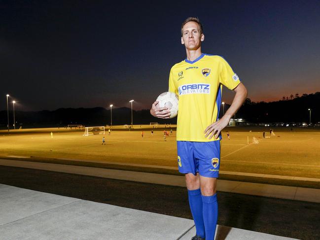 Gold Coast United's Rufus Scott, 13 with former Socceroo Michael Thwaite. Pic Tim Marsden