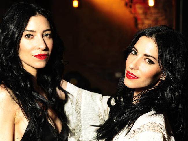 Jess and Lisa Origliasso at the Soda Factory in Surry Hills, Sydney have less punch ups these days. Picture: John Appleyard