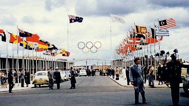  n19hb213 a1; 1/1 (supplied) Flags fly at the entrance to Heidelberg West Olympic Village in 1956. Pic: Courtesy of Heidelber...