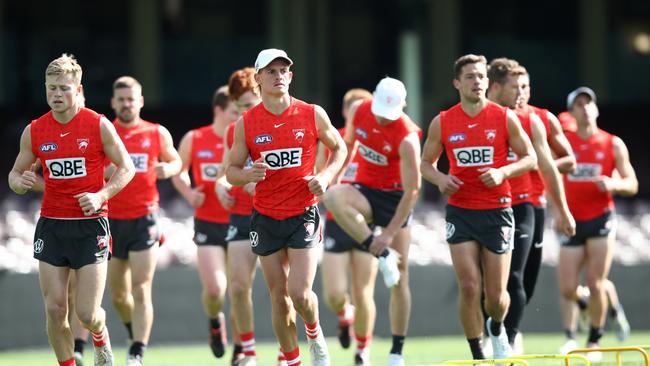 Swans players warm up at the SCG ahead of their preliminary final with Collingwood. Picture: Jason McCawley