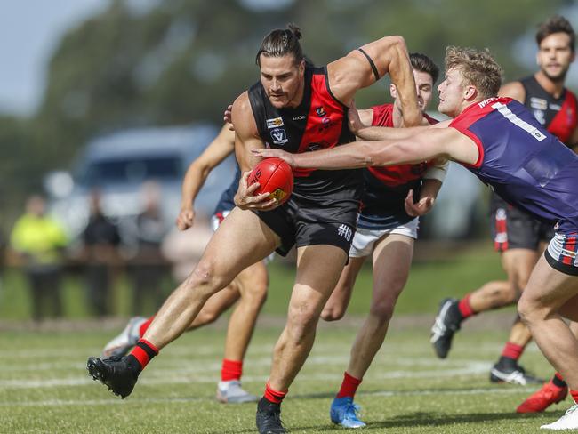 Frankston Bomber Khan Haretuku tries to shrug off Mt Eliza’s James Hammond. Picture: Valeriu Campan