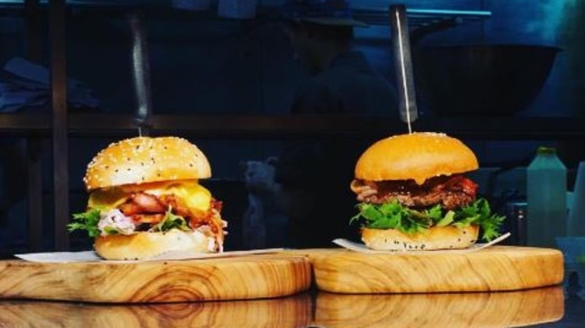 A big knife in a big burger at Longboards Laidback Eatery &amp; Bar.