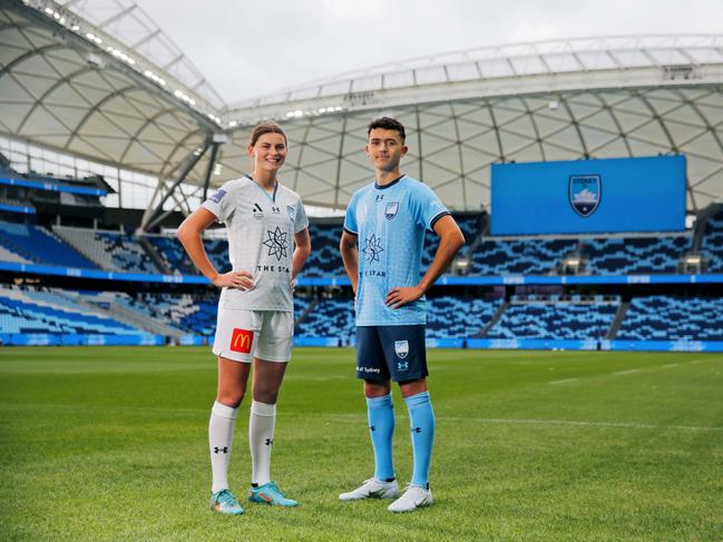 Charlie Rule (left) and Patrick Yazbek show off Sydney FC’s new playing strips at Allianz Stadium. Picture: Mark Evans.