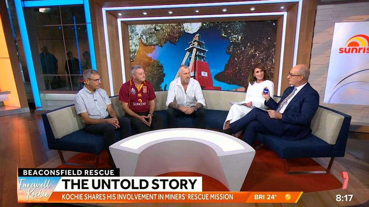 Kochie "David" Koch reunites with Beaconsfield Disaster survivors during his last show, holding the ID tag gifted to him by survivor Todd Russell (C) Picture: Sunrise