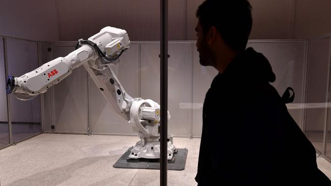 An industrial robot programmed to interact with humans at the new Design Museum in Kensington, London.