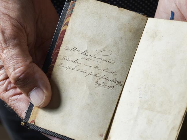 Descendant Ian Friend holds Lawrence’s Bible from the tour. Picture: Dannika Bonser