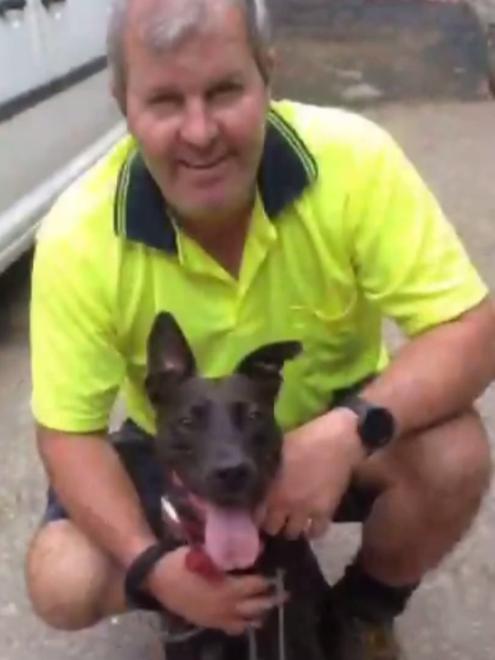Proud new owner Adam Troy with a very happy Coco.