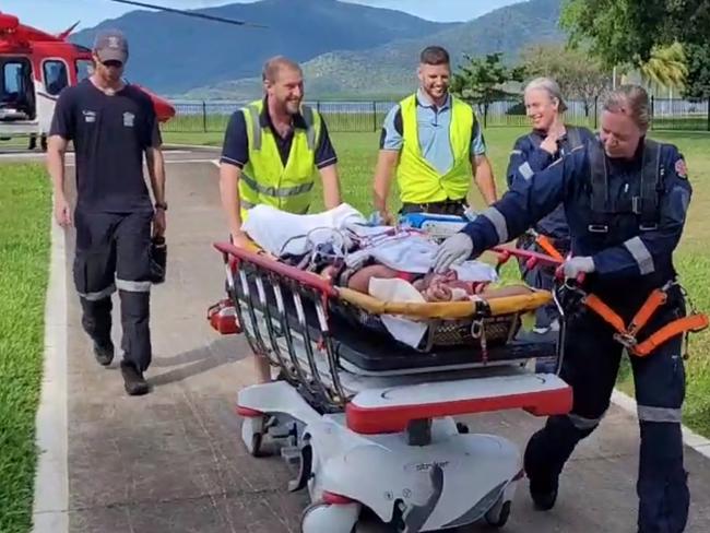 Video grabs of crocodile attack victim arriving at the Cairns Base Hospital on Rescue 510 helicopter, the attack took place at Archer Point south of Cooktown in North Queensland