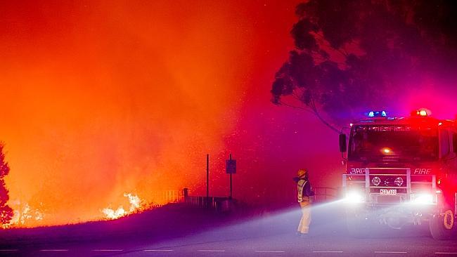 Firefighters battle the blaze.