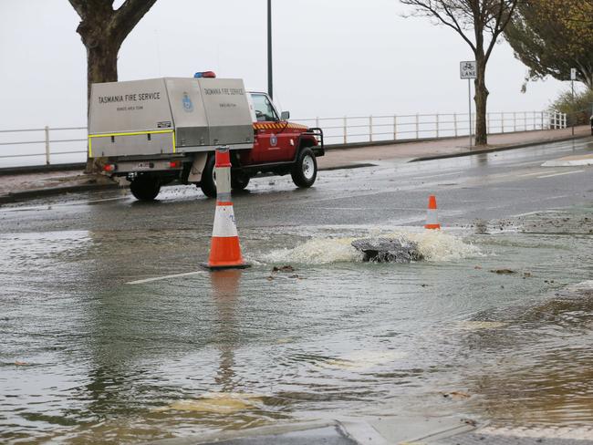 An overflowing sewage drain closed Sandy Bay Road south of Wrest Point. Flood damage in Kingston. Picture: MATHEW FARRELL