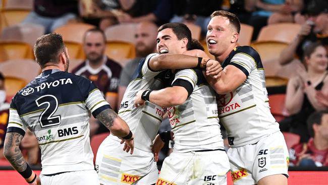 Jake Clifford celebrates scoring a try against the Broncos.