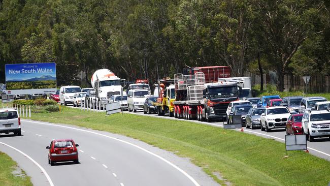 Traffic grinds to a halt before a checkpoint along the border between Queensland and NSW. Picture: Nigel Hallett