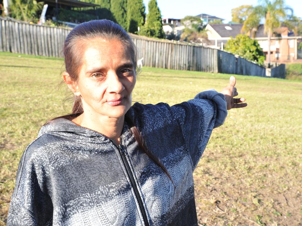 Bradford Pholi’s sibling Anita Pholi in 2018 shows the route her brother would have taken behind their family home on the day he disappeared. Picture: Jake McCallum