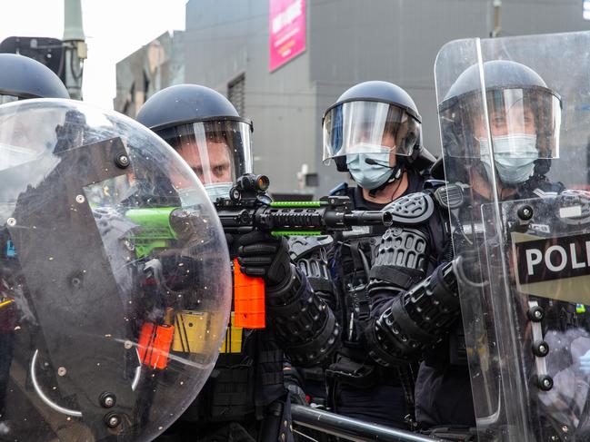 Police fire pellets into the crowd of anti-lockdown protesters. Picture: Sarah Matray