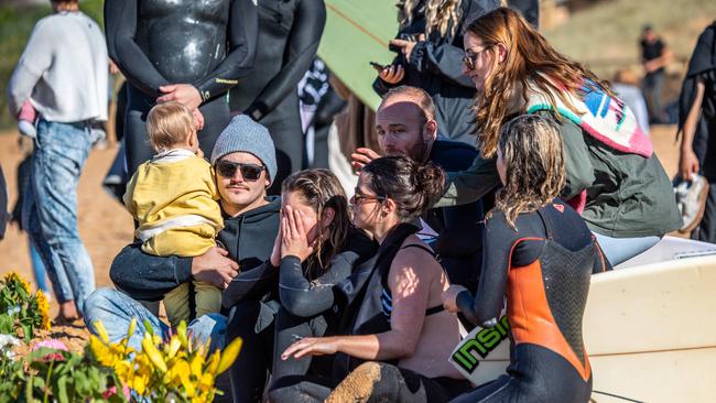 Mourners remember Chumpy at the emotional but beautiful paddle out. Picture: Monique Harmer