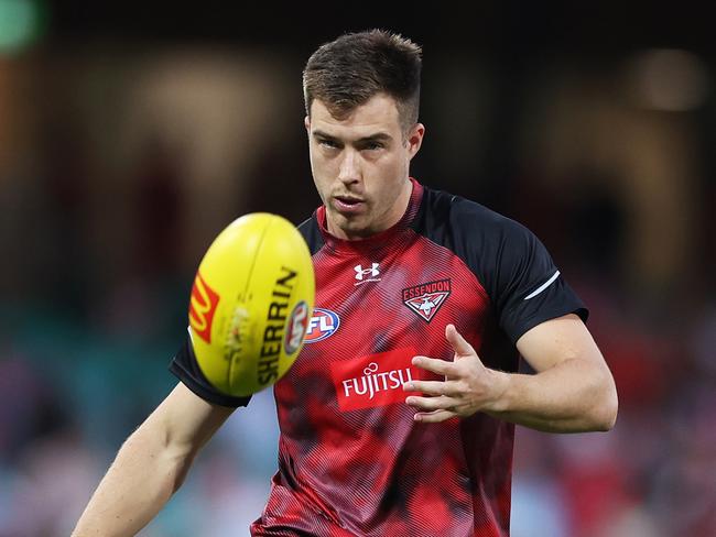 SYDNEY, AUSTRALIA - MARCH 23: Zach Merrett of the Bombers warms up during the round two AFL match between Sydney Swans and Essendon Bombers at SCG, on March 23, 2024, in Sydney, Australia. (Photo by Mark Metcalfe/AFL Photos/via Getty Images )