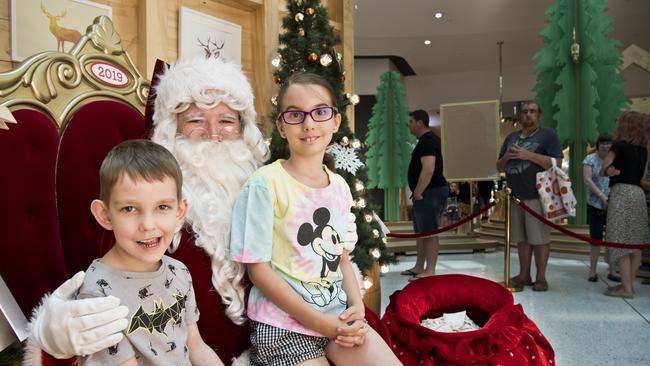 Channing Daniel, 5, and his sister Peyton Daniel, 8, meet Santa at Grand Central. Picture: Nev Madsen. Saturday, 16th Nov, 2019.