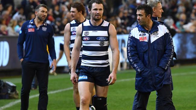 Patrick Dangerfield and Cats head coach Chris Scott discuss the star’s knee after last week's win over Essendon. Pic: Getty Images