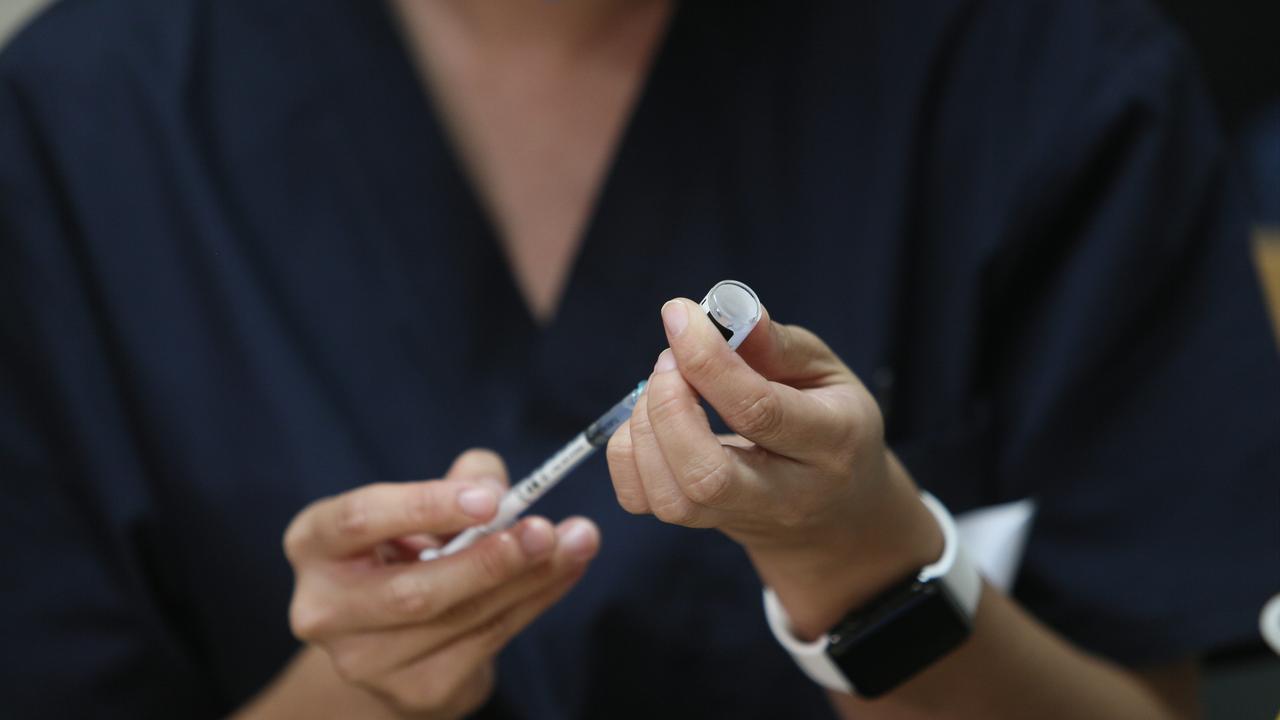 An immunisation nurse prepares a coronavirus vaccine. Picture: Emma Brasier