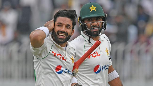 Mohammad Rizwan (left) and Iftikhar Ahmed leave the ground after Pakistan’s declaration. Picture: Aamir QURESHI / AFP