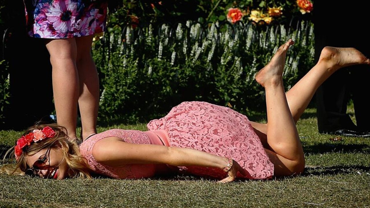 The shoes are off for this racegoer at the 2013 Cup. Picture: Hamish Blair/AAP