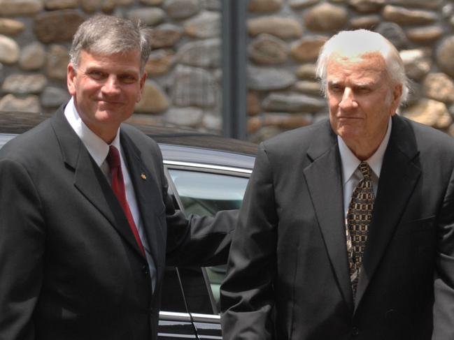 Franklin Graham, left, escorts his father Billy Graham prior to the funeral for their beloved Ruth Graham at Anderson Auditorium at the Montreat Conference Center, Saturday, June 16, 2007, in Montreat, North Carolina.  (Photo by Todd Sumlin/Charlotte Observer/MCT via Getty Images)