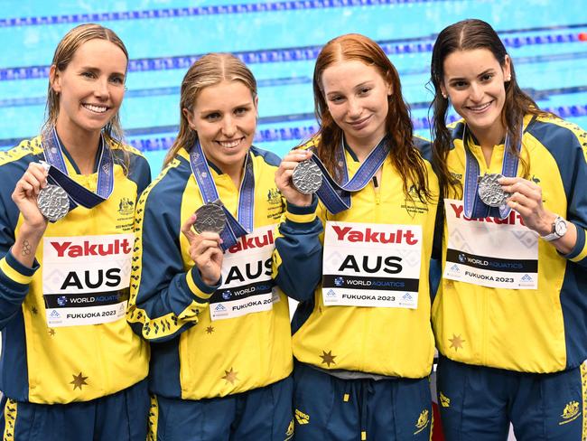 (L-R) Silver medallists Australia's Emma McKeon, Australia's Abbey Harkin, Australia's Mollie O'Callaghan and Australia's Kaylee McKeown pose during the medals ceremony for the women's 4x100m medley relay swimming event during the World Aquatics Championships in Fukuoka on July 30, 2023. (Photo by Yuichi YAMAZAKI / AFP)