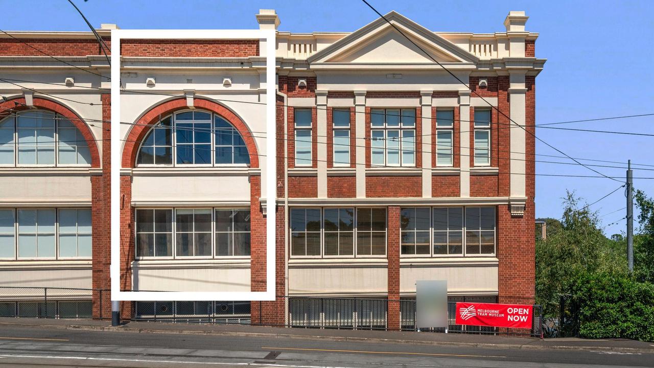 Soaring ceilings and historic windows define this Hawthorn tram depot home.