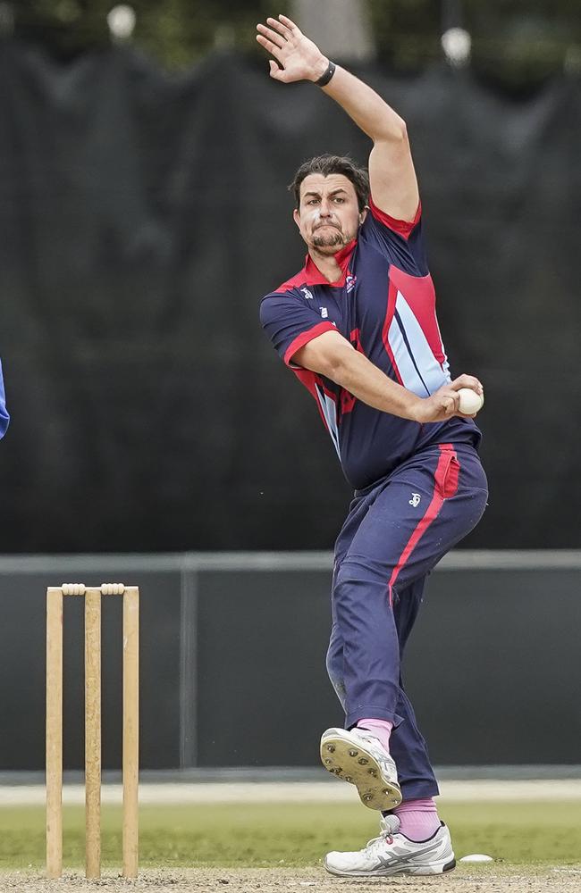 Peter Cassidy chipping away for Dandenong. Picture: Valeriu Campan