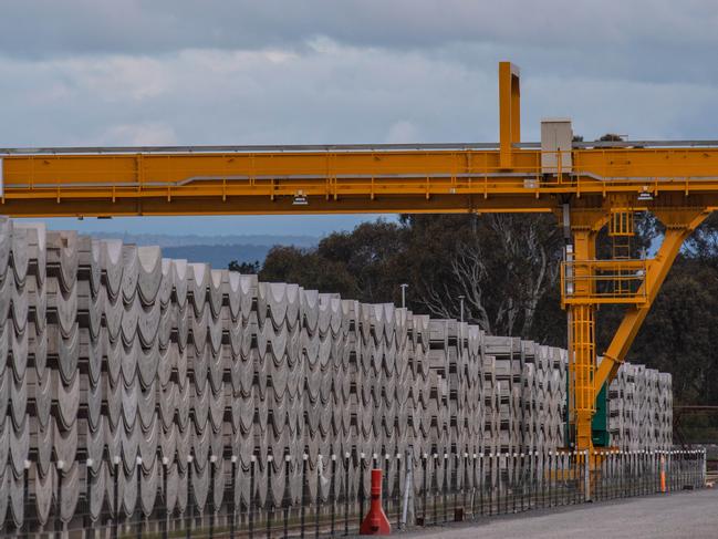 LS Precast factory making parts of the Westgate tunnel.Local residents Gerard Hamill, and. Steve Tobin at the bridge they say the beams cannot travel over on the Hume Freeway. HUNDREDS of giant concrete segments built to line the walls of the West Gate Tunnel will be trucked at a snails pace through regional towns and back roads because the government's rail plan for the project does not work.  Picture: Jason Edwards