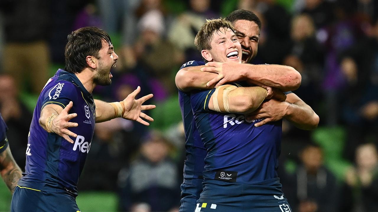 Harry Grant celebrates scoring a try with his Storm teammates.