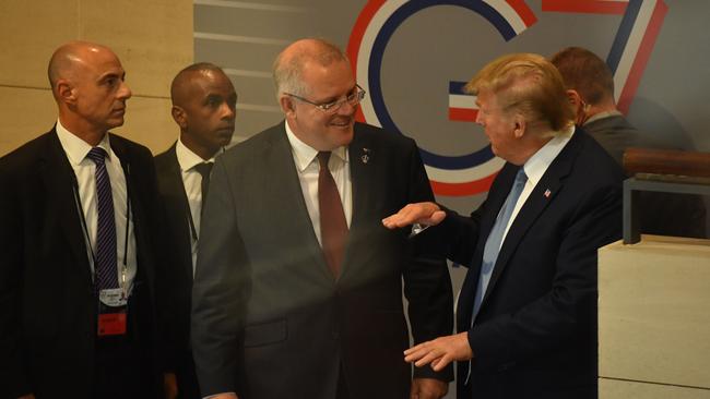 US President Donald Trump and Australia's Prime Minister Scott Morrison leave together after a meeting during the G7 Summit in the town of Biarritz. Picture: AAP