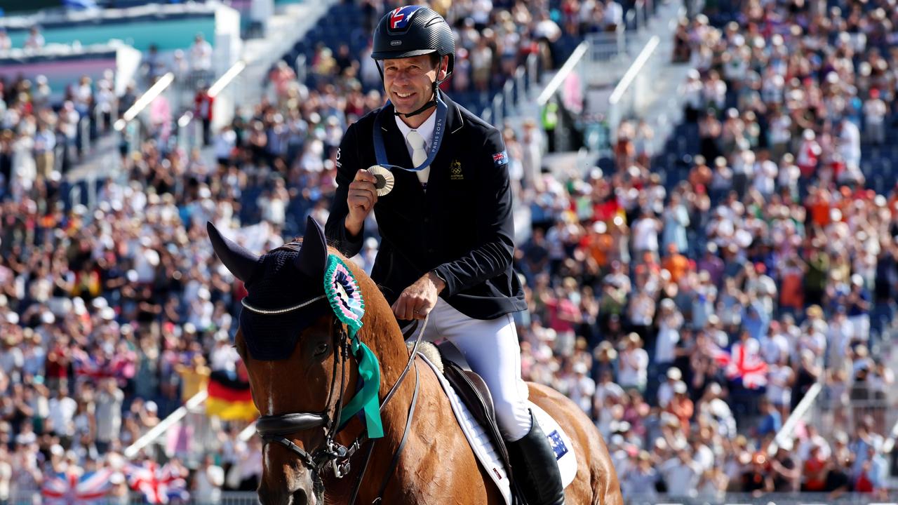 Silver medallist Christopher Burton of Team Australia with horse Shadow Man during a lap of honour after the medal ceremony for the Eventing Jumping Individual Final on July 29 at the historic Palace of Versailles. Picture: Kevin C. Cox/Getty Images